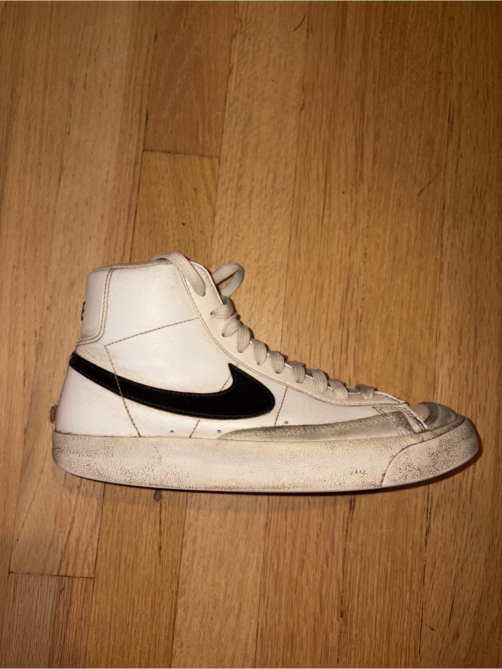 Nike Men’s White High-Top Sneaker with Black Swoosh Accent
